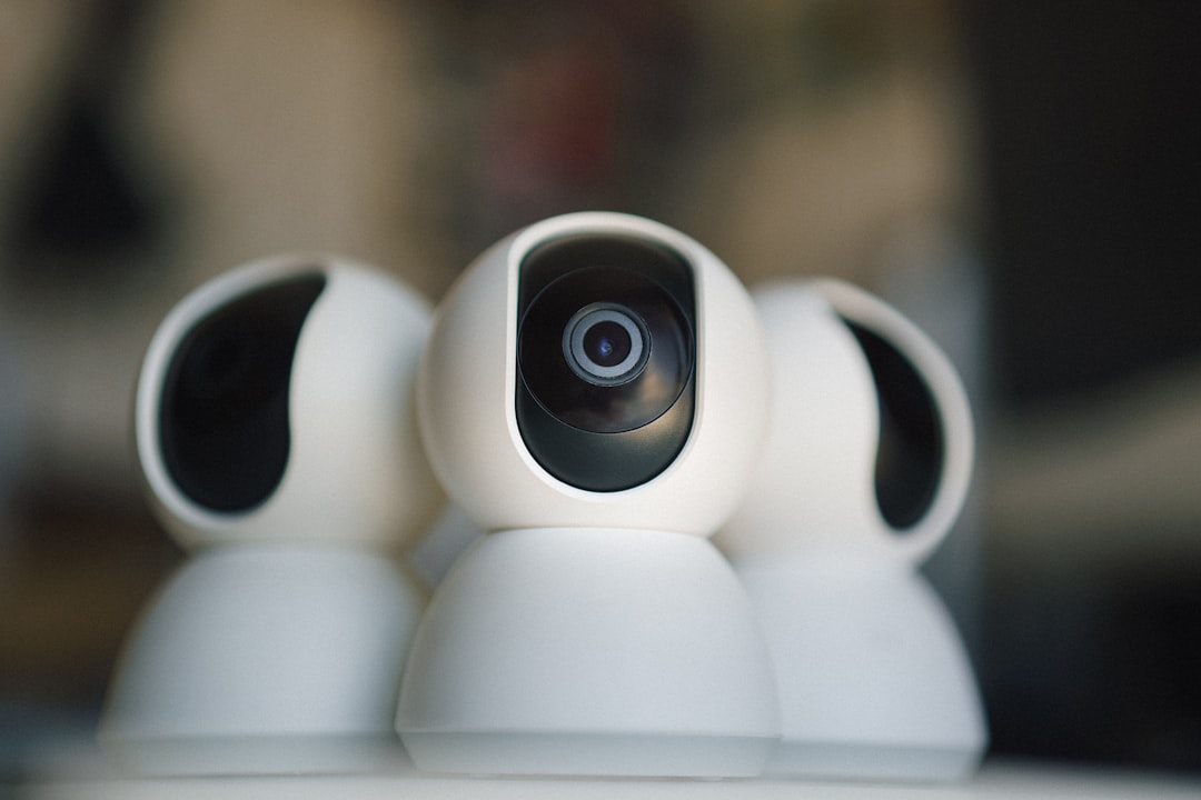 A close up of a camera on top of a table home security camera, indoor monitoring, smart surveillance