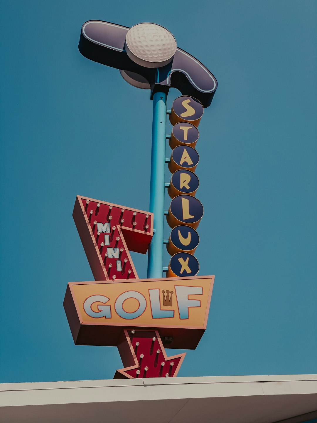 a close up of a golf sign with a sky background vintage golf tournament, 1960s golf crowd, old golf trophy