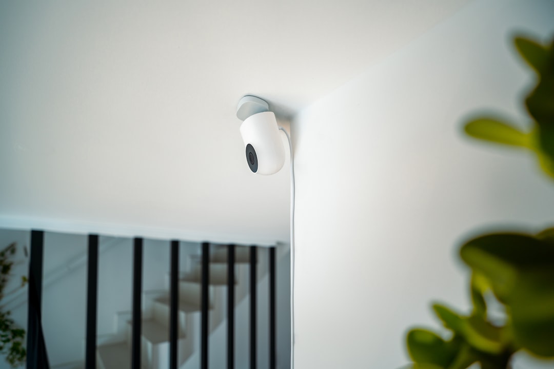 a close up of a light on a wall home security camera, indoor monitoring, smart surveillance