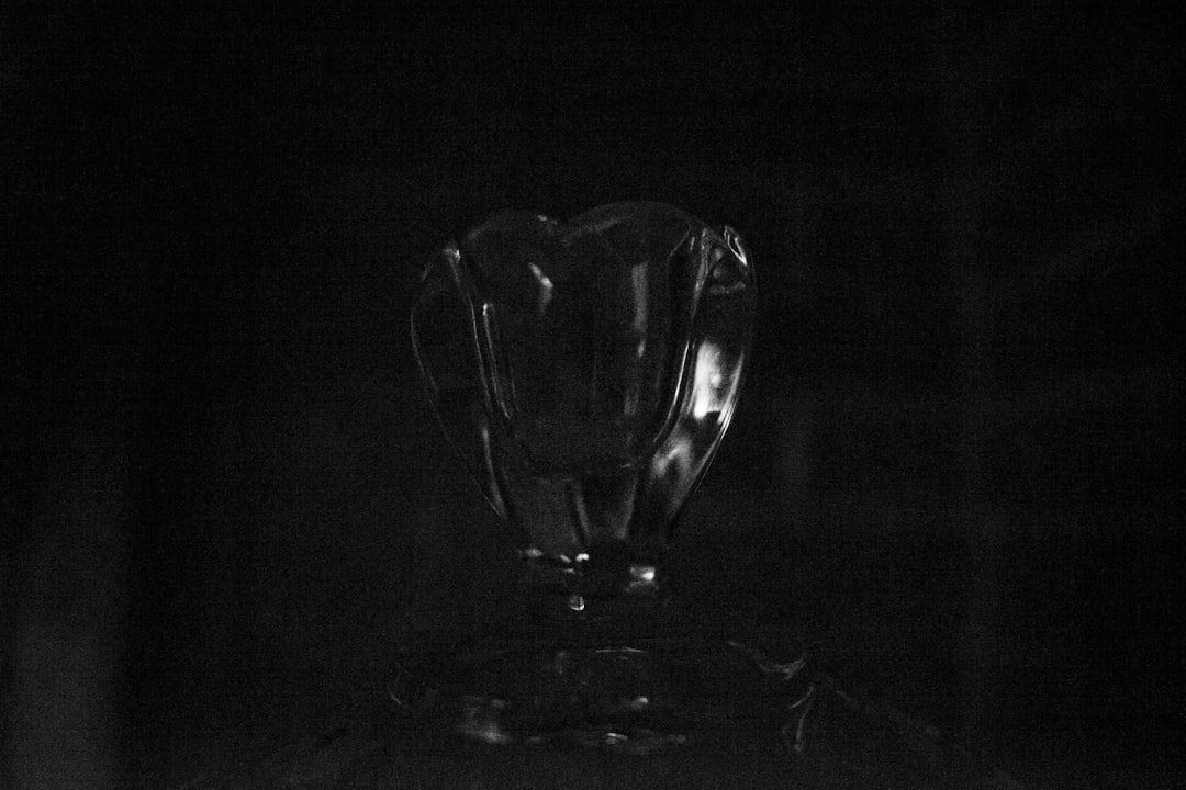 a glass vase sitting on top of a table football trophy close up, international match night, confetti celebration