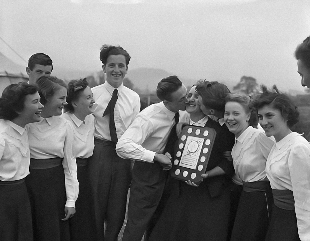 a group of people standing around each other holding a plaque vintage golf tournament, 1960s golf crowd, old golf trophy