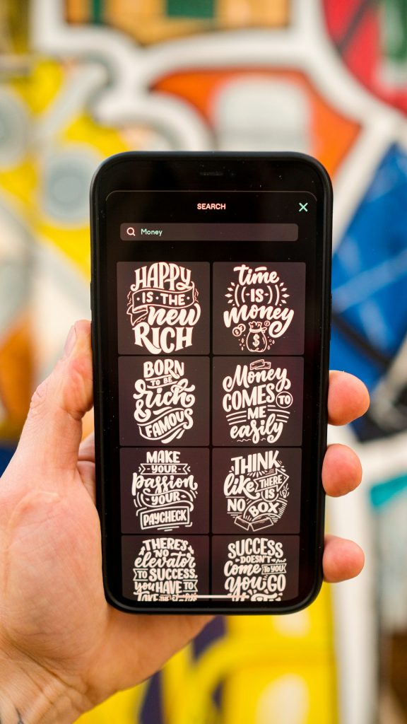 a person holding a cell phone football party invitation on phone screen, modern sports graphics, bold typography