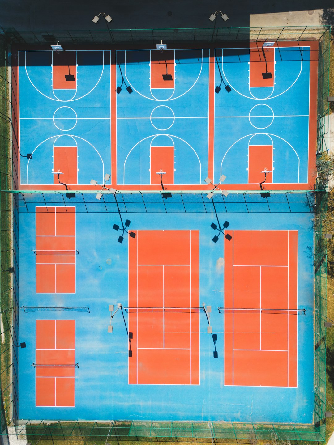 An overhead view of a blue and orange basketball court shuffleboard scoring zones diagram, 10 8 7 sections, penalty area minus 10, labeled court view