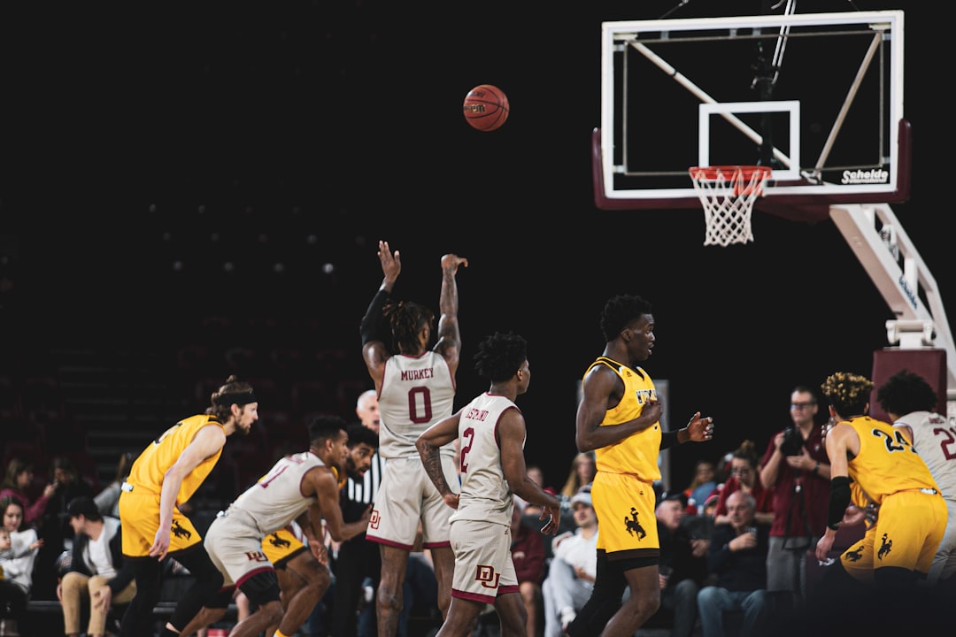 man shooting the ball on the free throw line basketball rebound action, players jumping for ball, nba paint battle