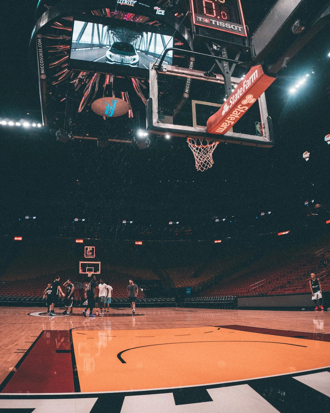 players inside basketball court nba point guard driving, arena lights, intense basketball moment