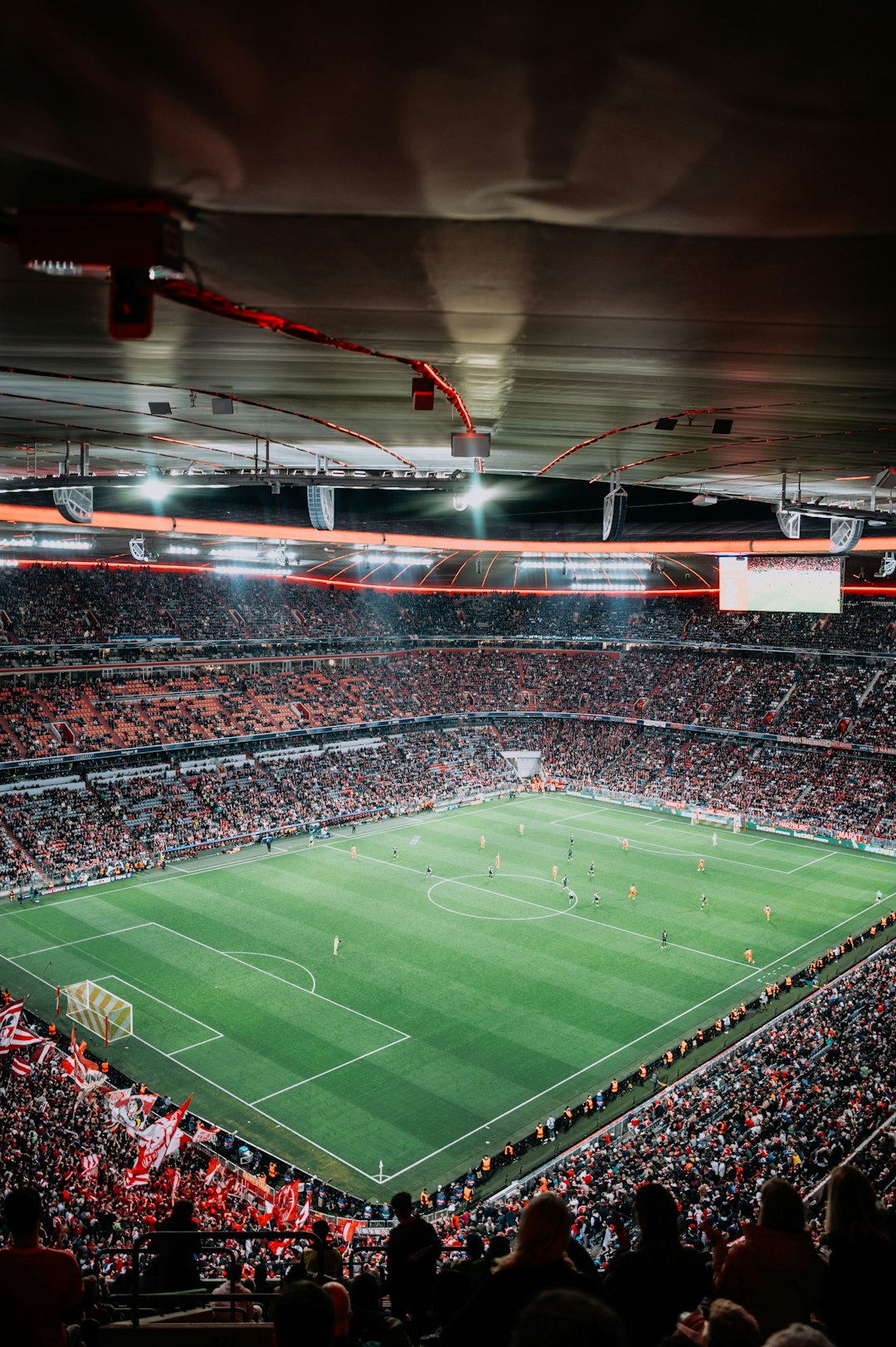 Soccer match in a packed stadium at night. football stadium crowd night lights