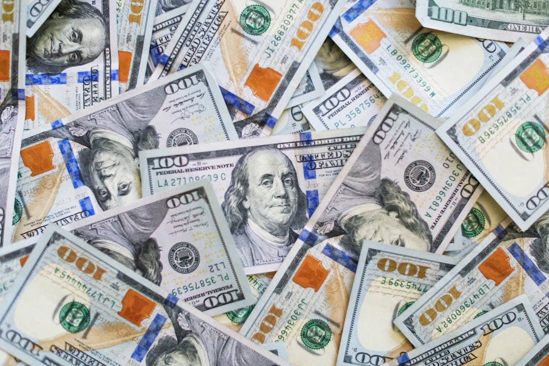 100 us dollar bill nfl contract signing, football player agent negotiation, dollar bills sports deal