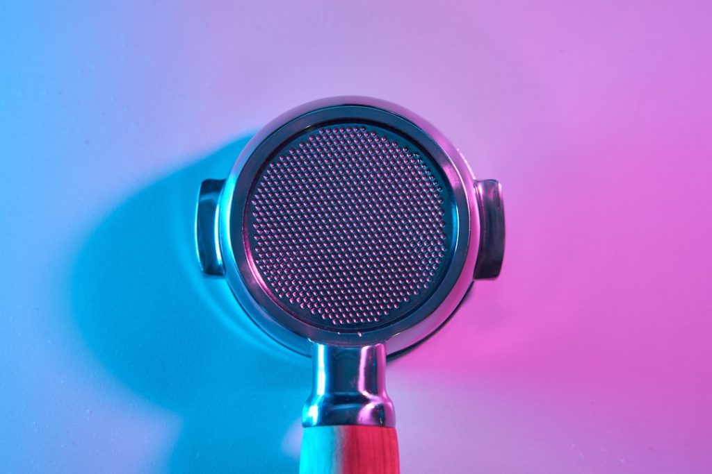 a close up of a light podcast studio microphones, women hosting podcast, colorful recording setup