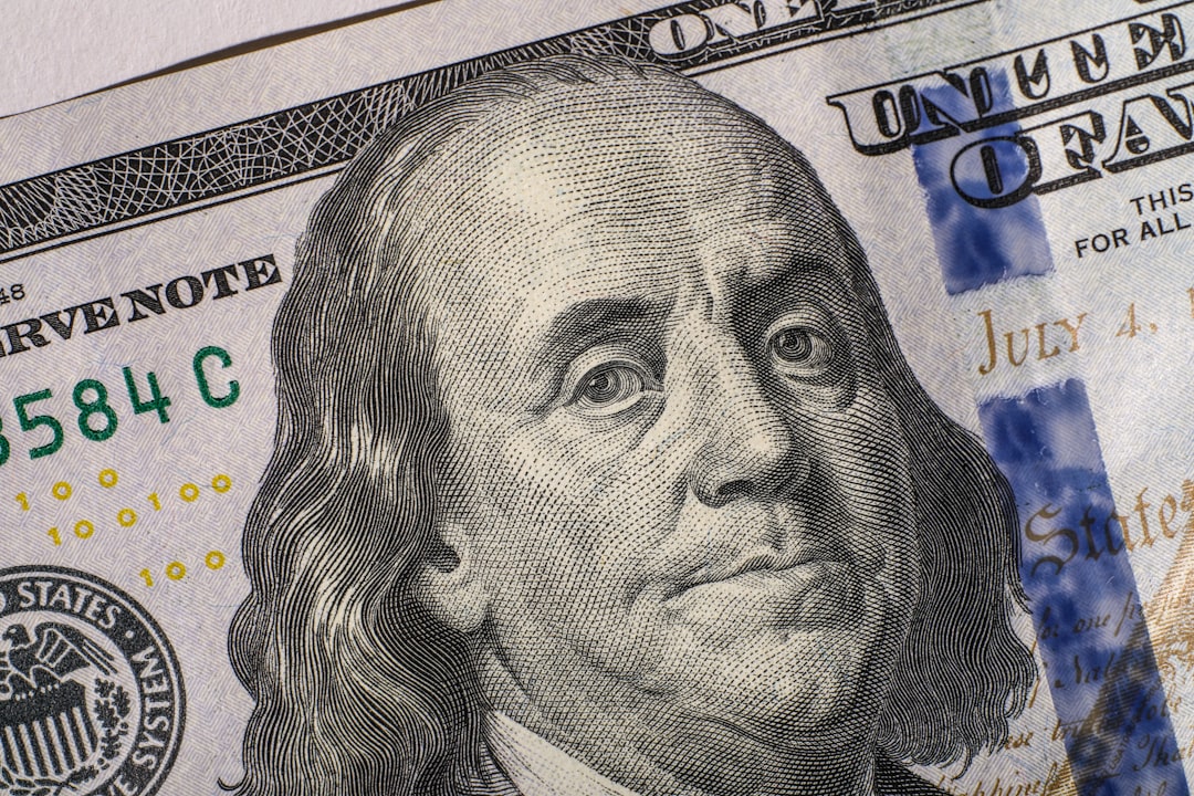 Close up of a united states one hundred dollar bill. nfl contract signing, football player agent negotiation, dollar bills sports deal