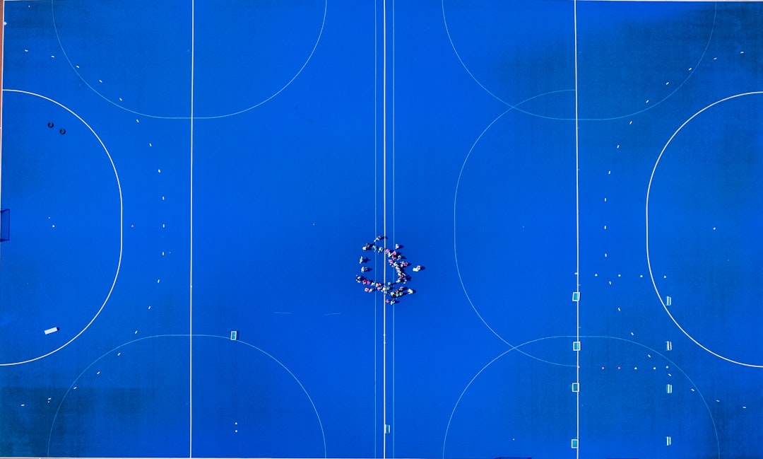 A blue basketball court with a bunch of circles on it basketball pick and roll, defensive coverage, coach diagram board