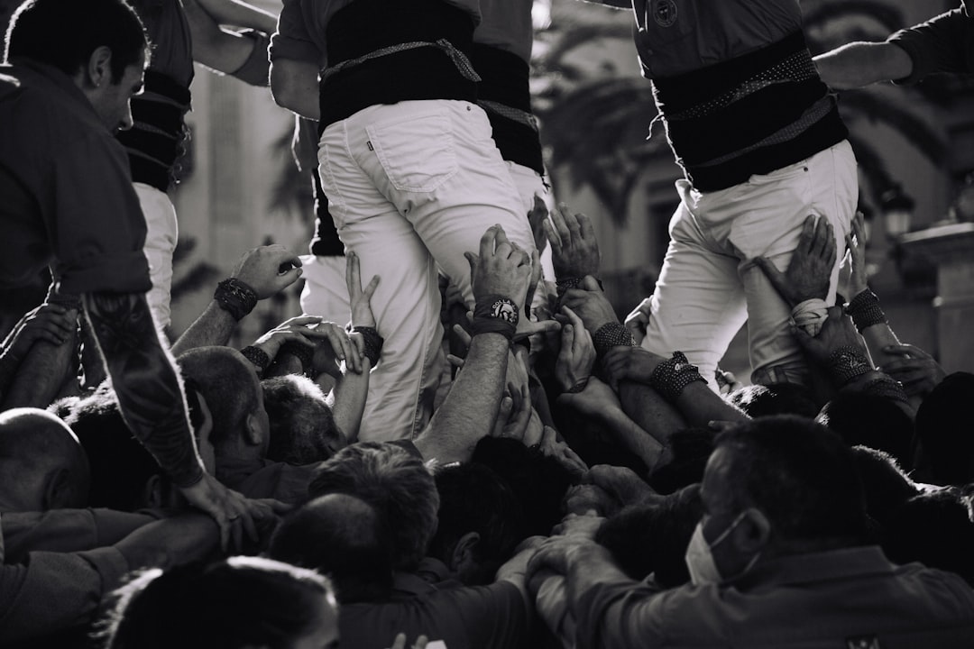 a group of people in a crowd baseball parents cheering, family support, youth sports crowd