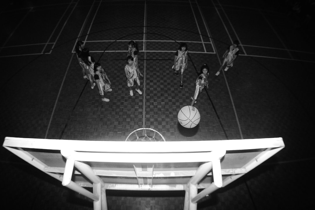 a group of women playing basketball basketball player close range shot, youth gym practice, proper shooting form