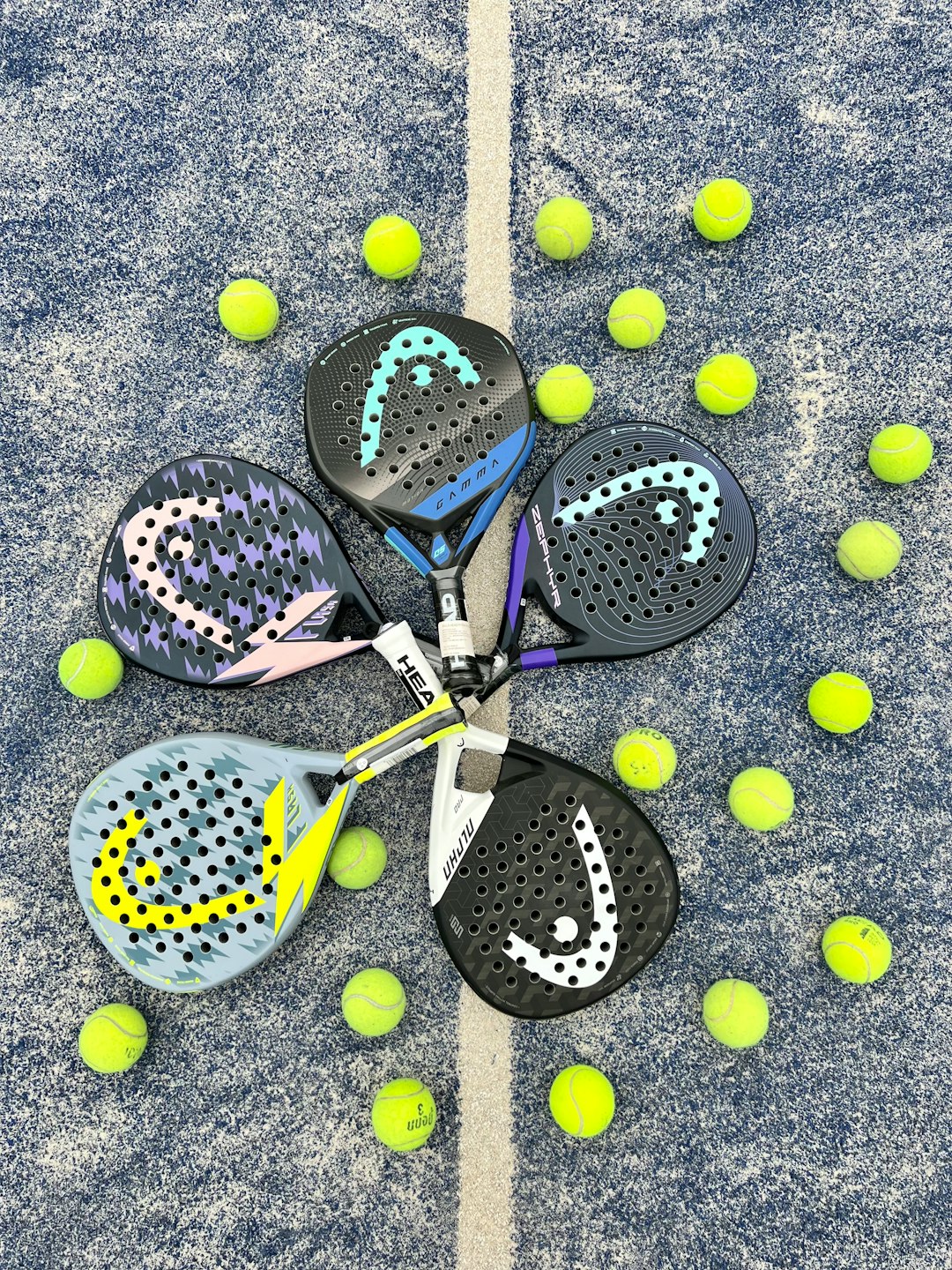 a pair of tennis rackets and balls on the ground tennis rackets lineup on court, beginner tennis equipment, tennis balls and rackets