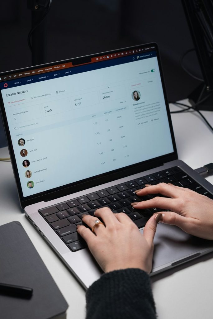 a person typing on a laptop on a desk remote desktop interface on laptop, person working remotely, secure connection screen