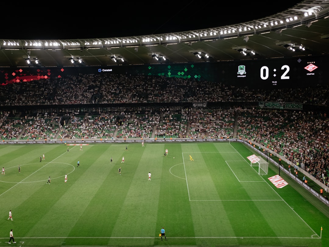 a soccer field with a lot of people on it fantasy football, team manager, scoreboard