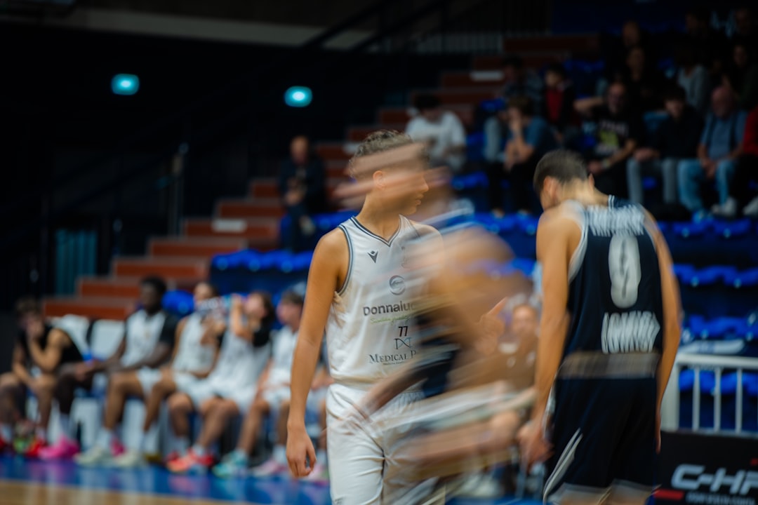 Basketball players during a game with motion blur. basketball team huddle, players communicating, intense focus