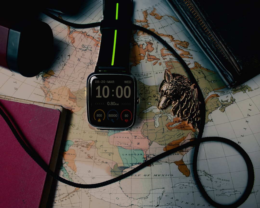 black and silver digital watch music streaming analytics dashboard, world map digital, headphones on desk