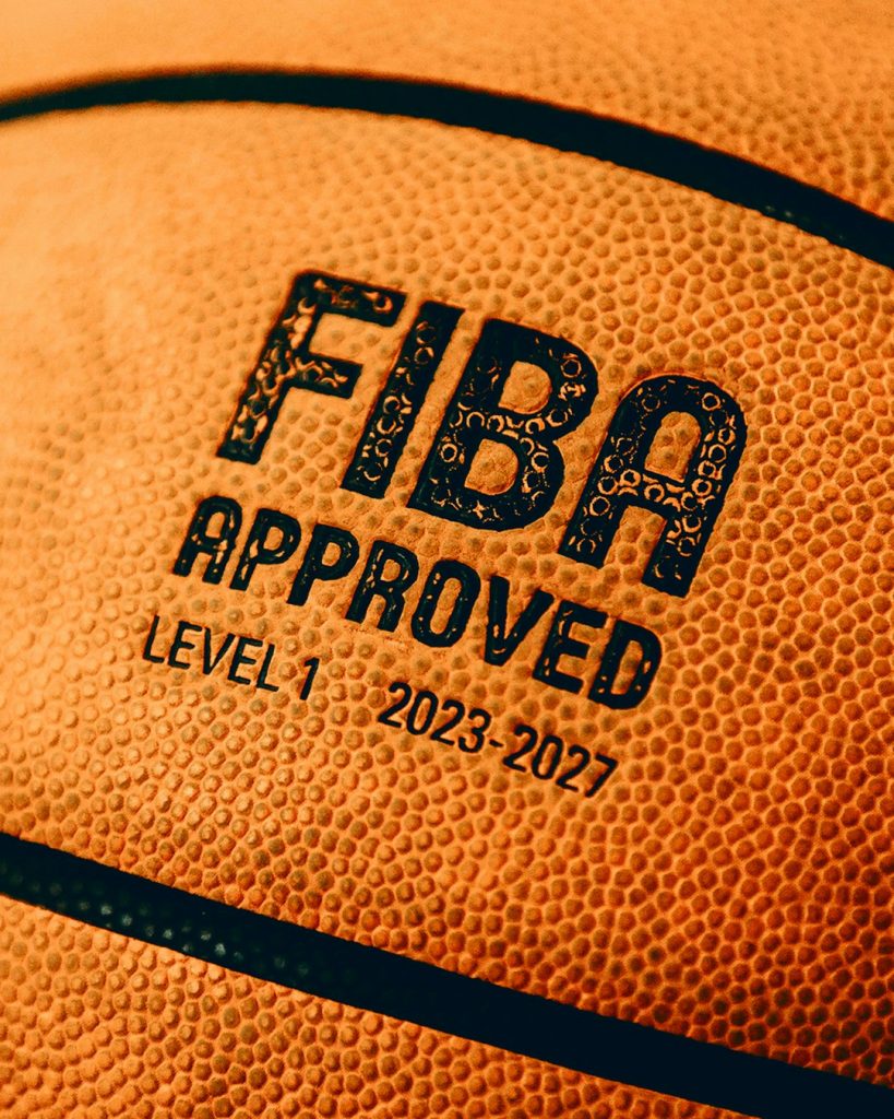 Close up of a basketball with fiba approval. young basketball academy training Europe, college basketball game USA, player development practice