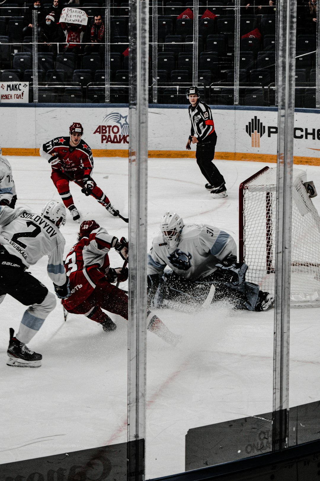 ice hockey players on ice field Stanley Cup trophy, playoff hockey game, intense ice battle