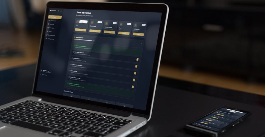 Laptop and phone displaying financial data api dashboard comparison interface laptop screen charts