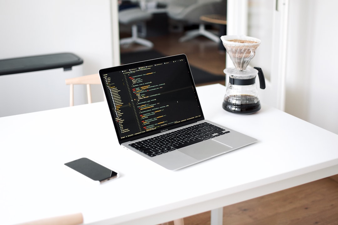macbook pro on white table api dashboard comparison interface laptop screen charts