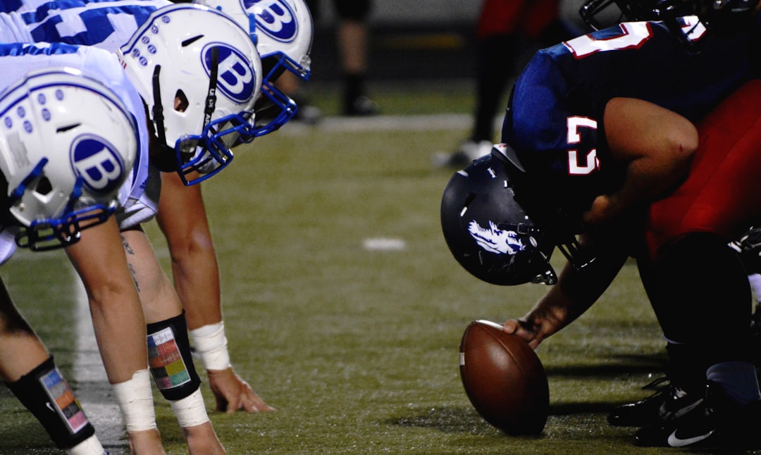 NFL player setting game college football team huddle strategy