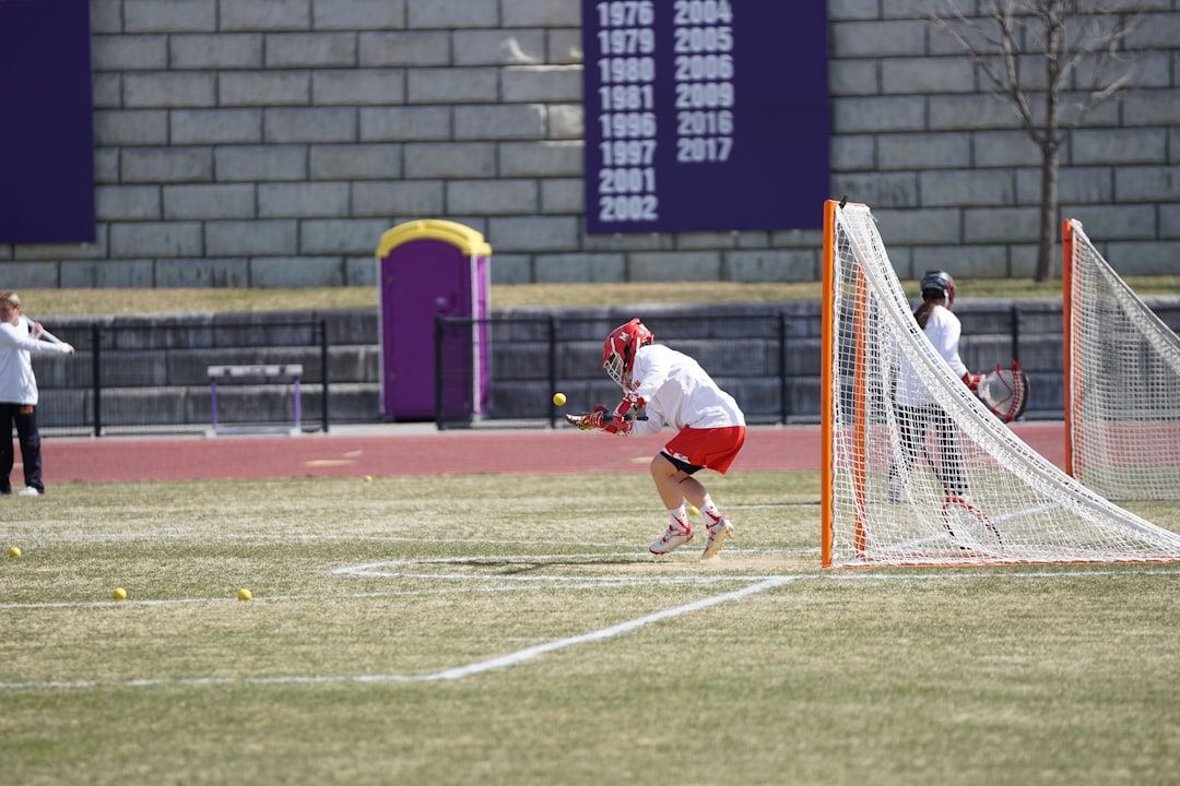 player on grass field padel smash angle shot glass wall opponent defending