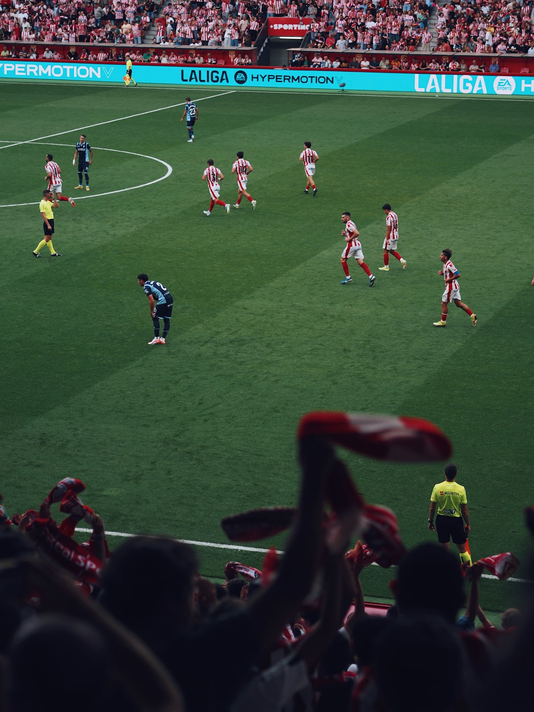 Soccer players on a green field during a match. fantasy football manager, waiver wire, trade analysis, weekly lineup
